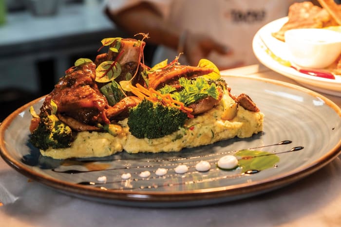 Slow cooked beef ribs on semolina puree with vegetables